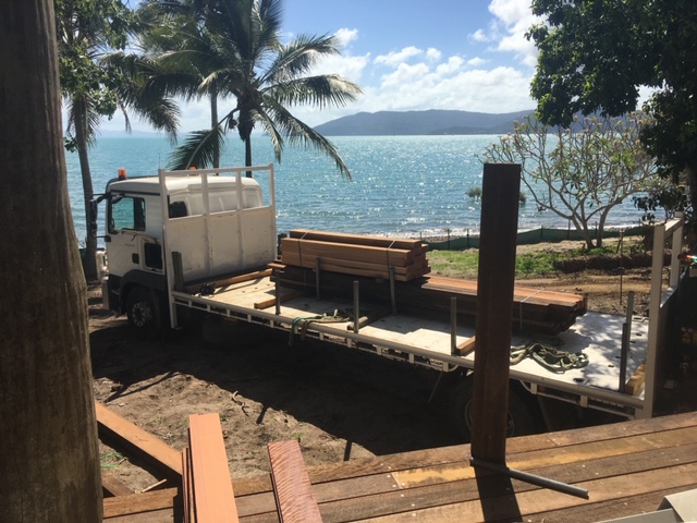 Hardwood timber delivered by truck to a beachfront build near Mackay
