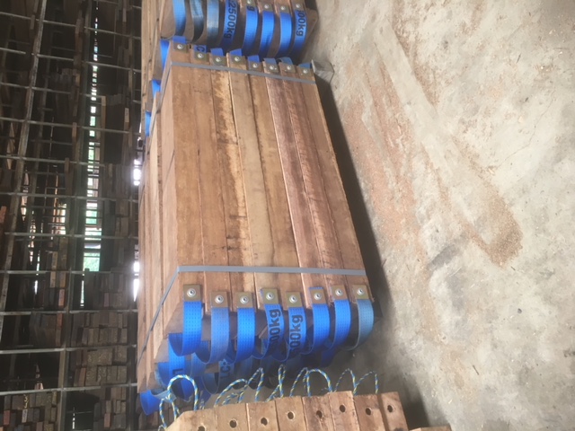 Strapped packs of hardwood timber in the mill shed ready for despatch