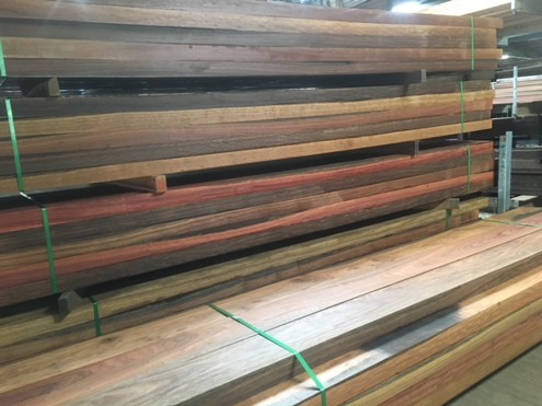 Stacks of oiled timber boards stored at the Platypus Timbers yard